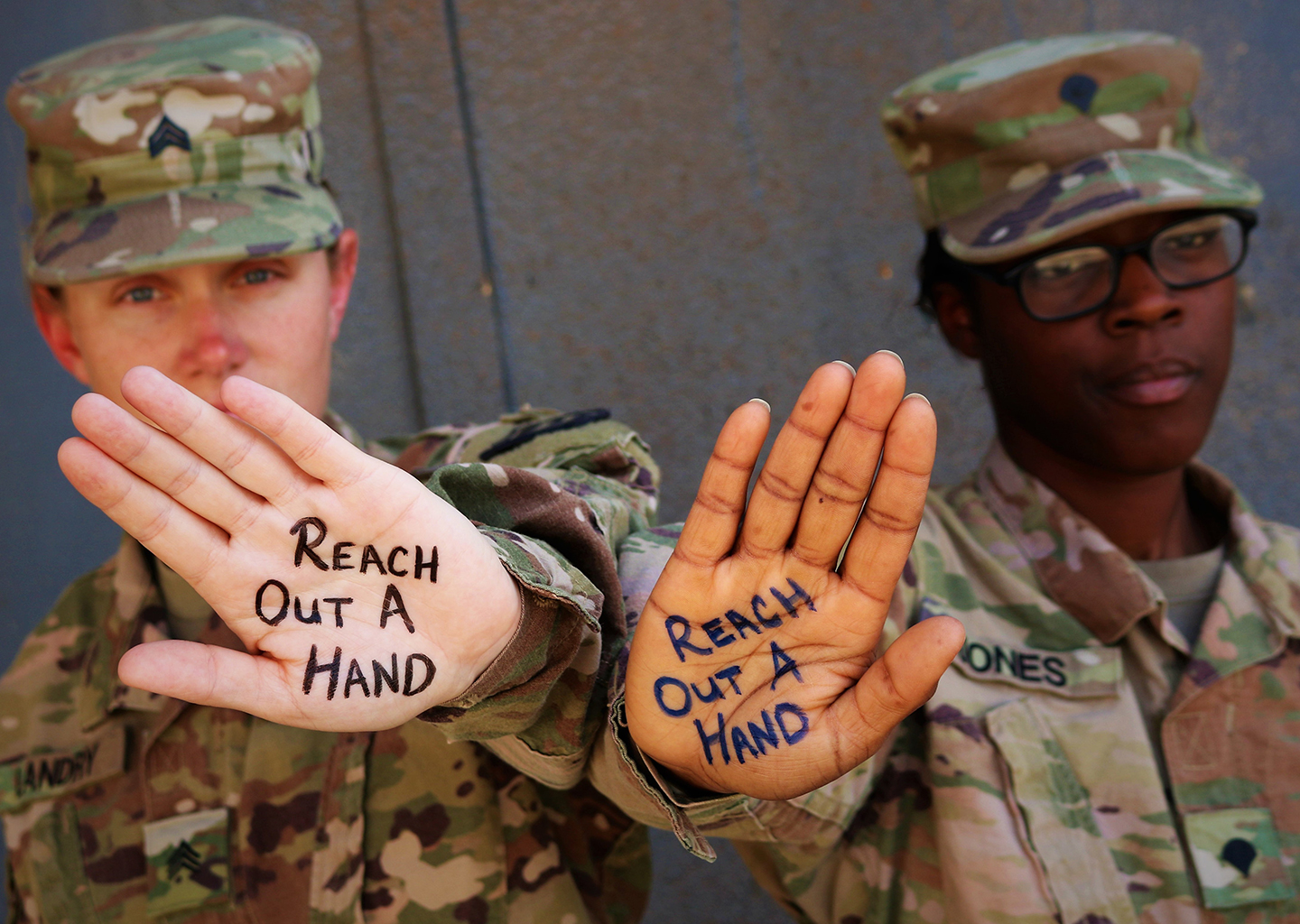 Soldiers with Reach Out written on their hands Soldiers with Reach Out written on their hands